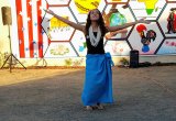 a local dancer helps celebrate the unveiling of Lemoore's newest mural entitled "The Fabric of Our Heritage," Friday afternoon in downtown Lemoore.